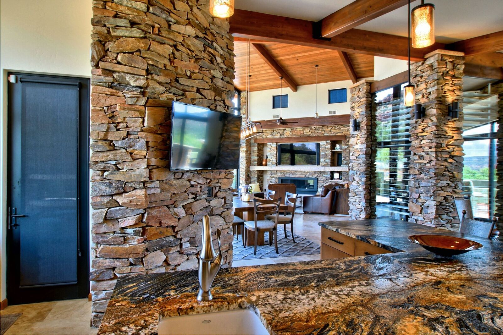 A stone wall in the center of a room.