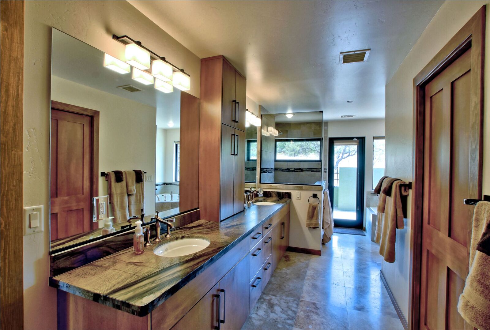 A large bathroom with a sink and counter.